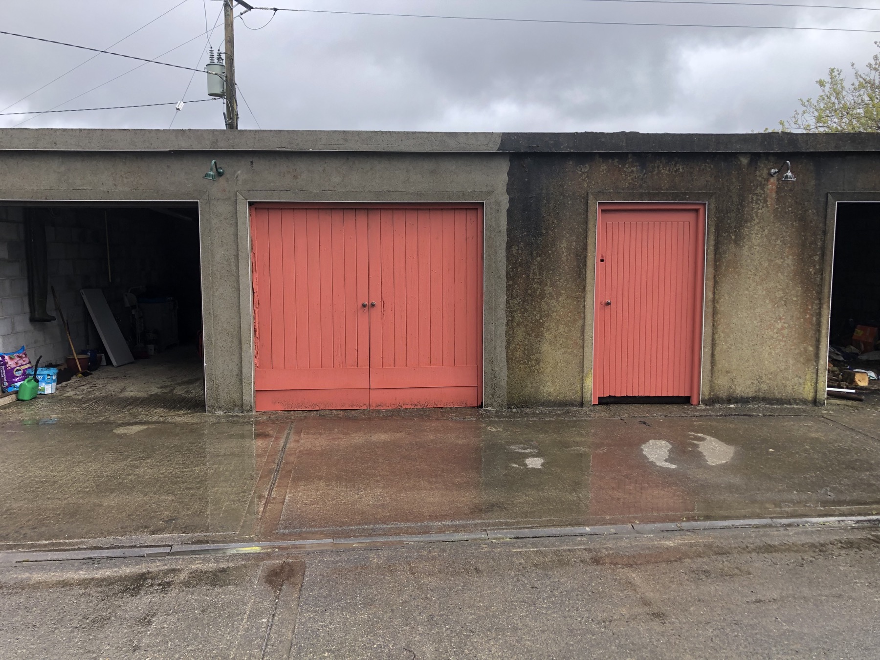 Power washing in progress, showing cleaned and untreated areas